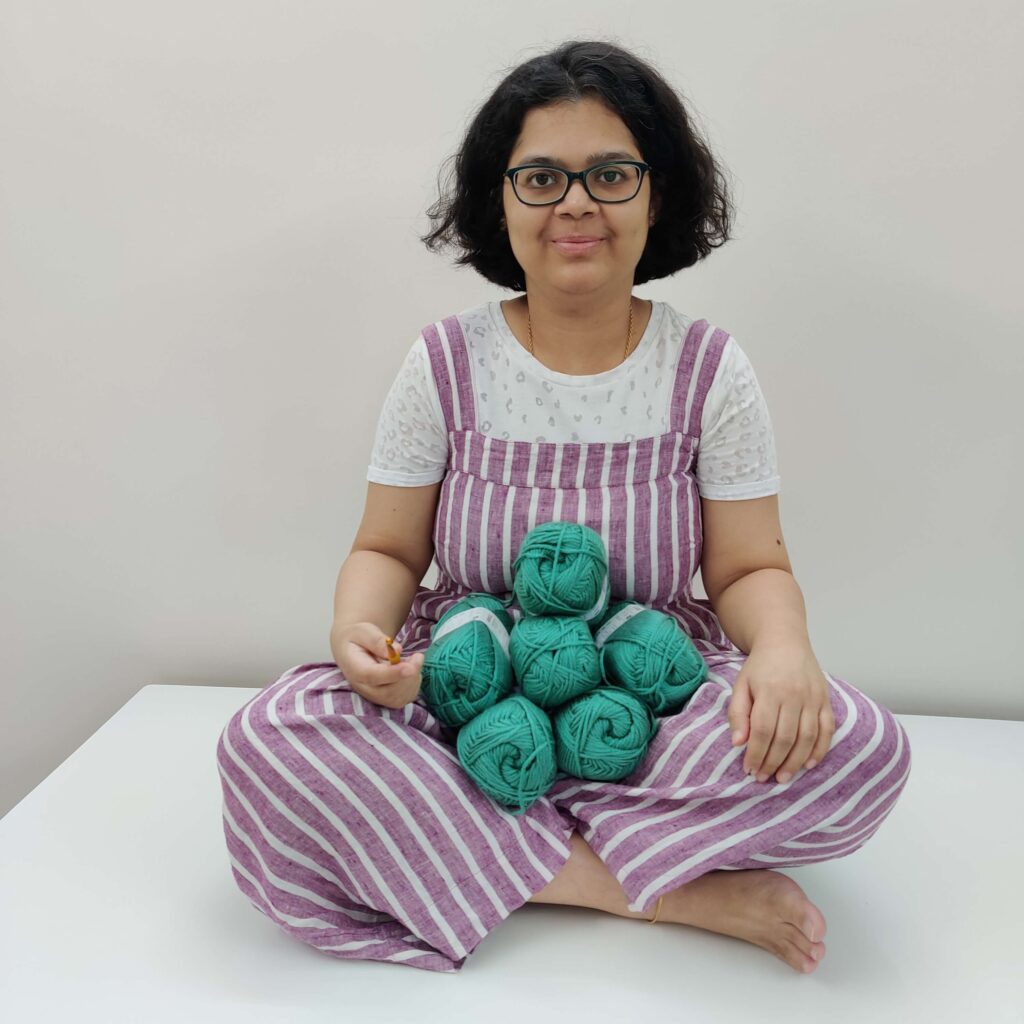 me on a table with yarn in lap